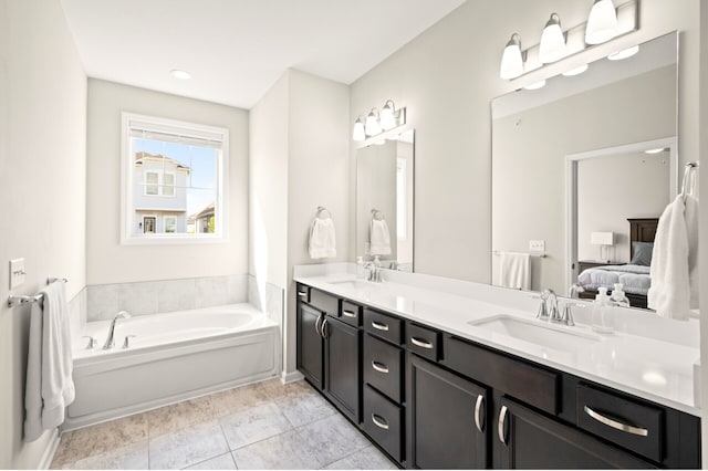 8120 Arrowwood Ln N, Maple Grove, MN 55369 - ensuite bathroom featuring double vanity and a bath