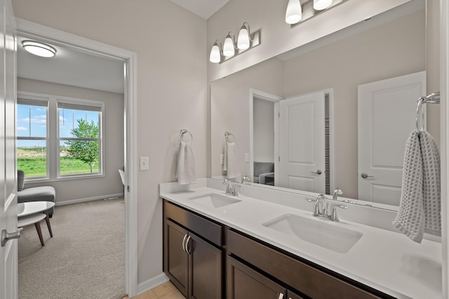 8120 Arrowwood Ln N, Maple Grove, MN 55369 - bathroom with double vanity and baseboards