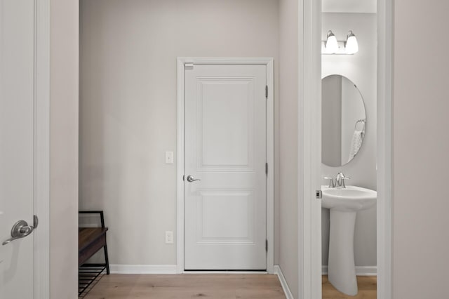 8120 Arrowwood Ln N, Maple Grove, MN 55369 - bathroom featuring wood finished floors and baseboards