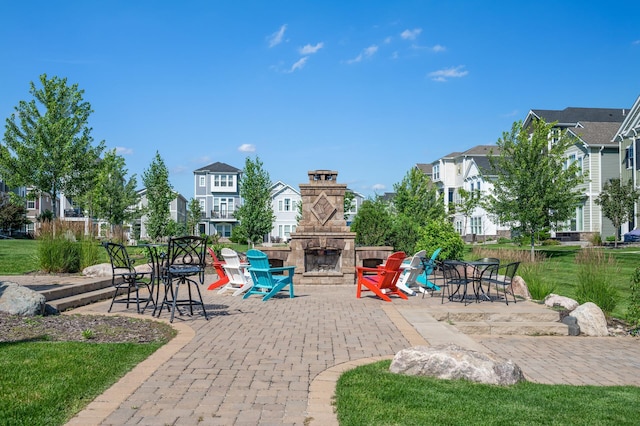 8120 Arrowwood Ln N, Maple Grove, MN 55369 - view of patio featuring an outdoor stone fireplace and a residential view
