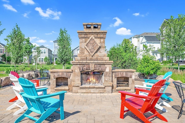 8120 Arrowwood Ln N, Maple Grove, MN 55369 - view of patio / terrace with an outdoor stone fireplace and a residential view