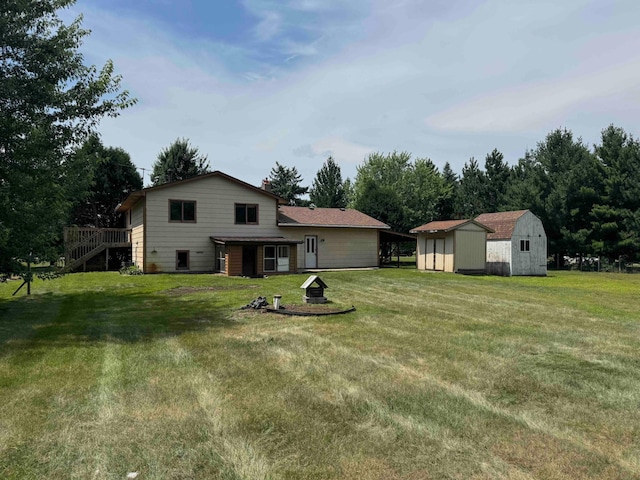 18627 148th St NW, Big Lake Twp, MN 55330 - back of property with a shed, a lawn, stairway, and a fire pit