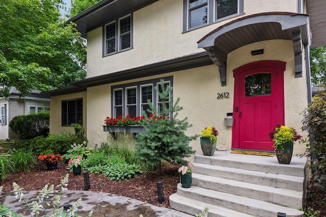 2612 52nd St, Minneapolis, MN 55410 - doorway to property with stucco siding
