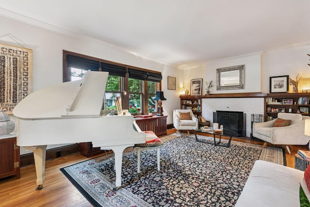 2612 52nd St, Minneapolis, MN 55410 - living room with ornamental molding, wood finished floors, and a fireplace