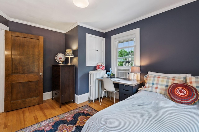 2612 52nd St, Minneapolis, MN 55410 - bedroom with radiator heating unit, wood-type flooring, and crown molding