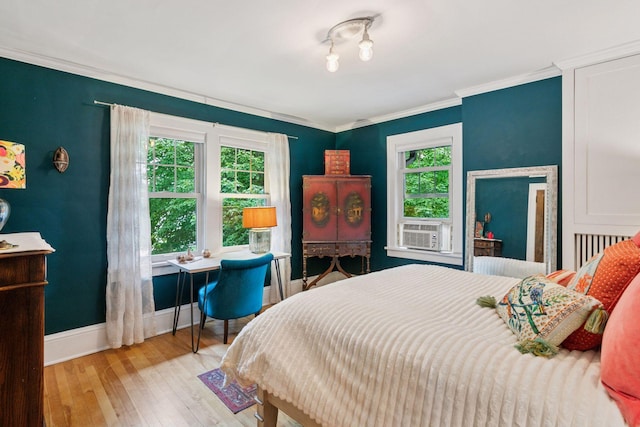 2612 52nd St, Minneapolis, MN 55410 - bedroom with wood-type flooring, crown molding, and cooling unit