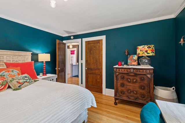 2612 52nd St, Minneapolis, MN 55410 - bedroom featuring light wood-style floors and ornamental molding