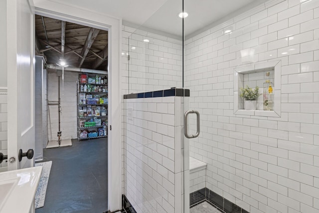 2612 52nd St, Minneapolis, MN 55410 - bathroom with a shower stall, finished concrete flooring, and vanity