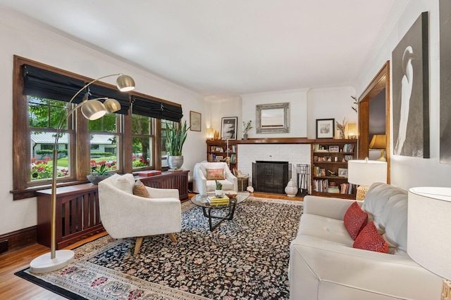 2612 52nd St, Minneapolis, MN 55410 - living area with wood finished floors, healthy amount of natural light, a fireplace, and ornamental molding