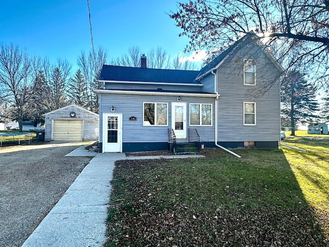 2716 Canterbury Dr, Bigelow, MN 56117 - traditional home with an outdoor structure, a garage, a chimney, entry steps, and a front lawn