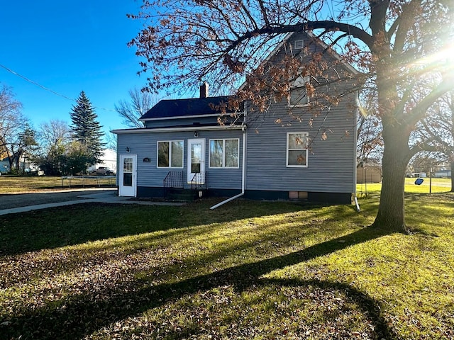 2716 Canterbury Dr, Bigelow, MN 56117 - view of front of home with a front lawn, entry steps, and a chimney