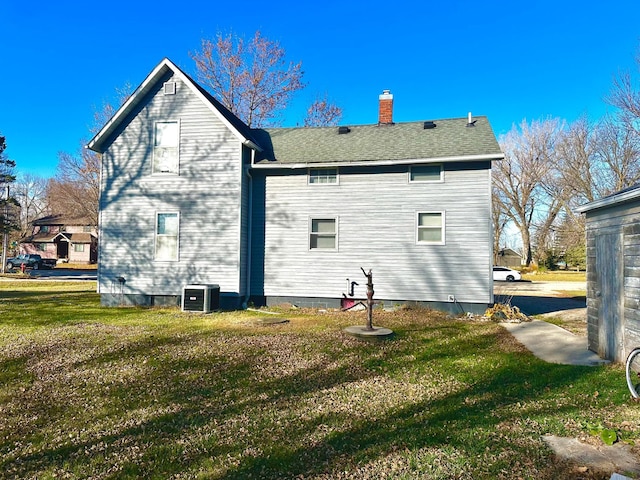2716 Canterbury Dr, Bigelow, MN 56117 - back of house featuring a lawn and a chimney