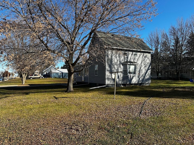 2716 Canterbury Dr, Bigelow, MN 56117 - view of side of home featuring a yard
