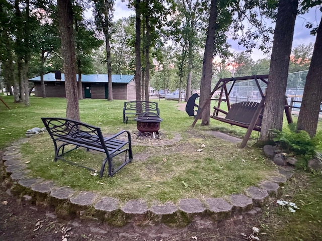 15827 Wilderness Trl Unit 127, Crosslake, MN 56442 - view of green lawn featuring a fire pit