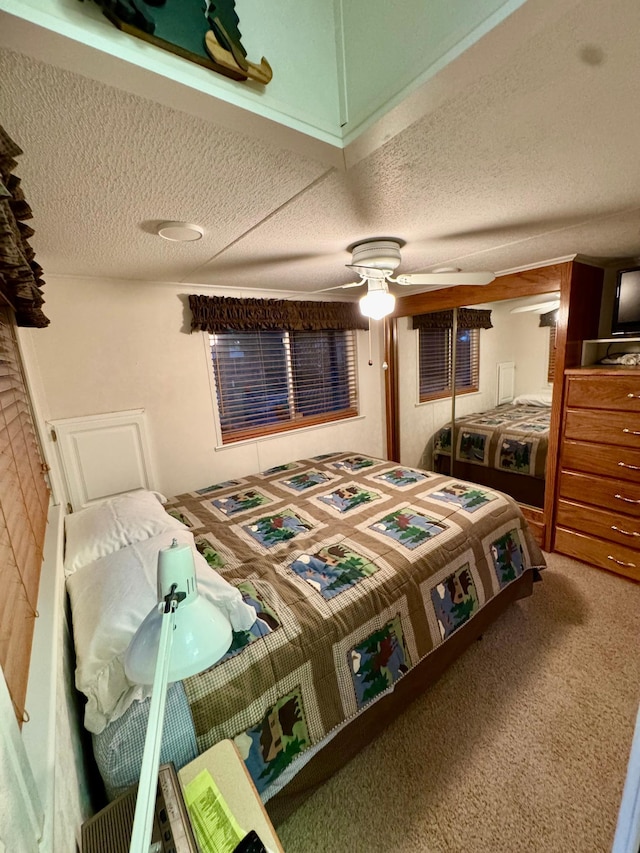 15827 Wilderness Trl Unit 127, Crosslake, MN 56442 - carpeted bedroom featuring a textured ceiling and a ceiling fan