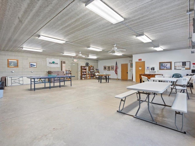 15827 Wilderness Trl Unit 127, Crosslake, MN 56442 - miscellaneous room featuring finished concrete floors, concrete block wall, and ceiling fan