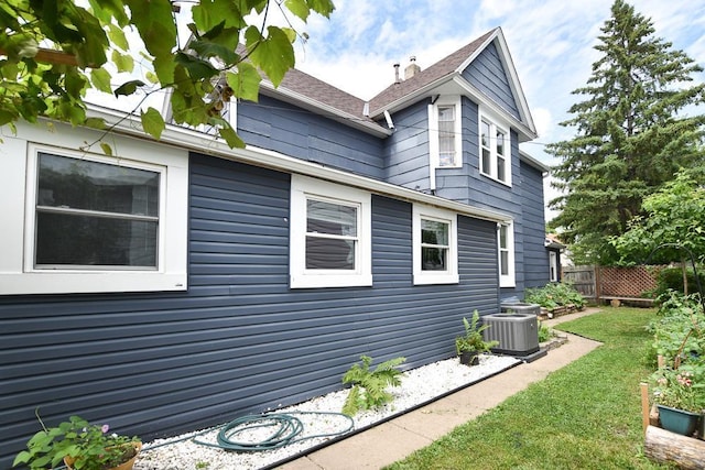 400 Blair Ave, Saint Paul, MN 55103 - view of side of property with a cooling unit and a shingled roof