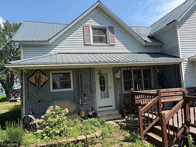 W5168 Lake Rd, Warner Twp, WI 54437 - view of front of property featuring a metal roof and a porch