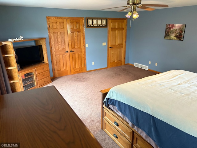 W5168 Lake Rd, Warner Twp, WI 54437 - bedroom featuring carpet, a closet, and a ceiling fan