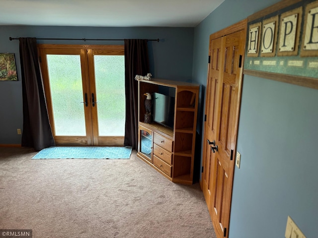 W5168 Lake Rd, Warner Twp, WI 54437 - unfurnished living room with carpet flooring and french doors