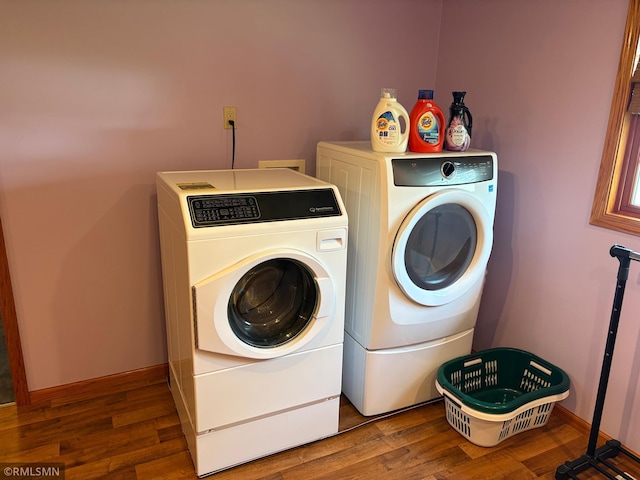 W5168 Lake Rd, Warner Twp, WI 54437 - laundry area featuring washer and clothes dryer and wood finished floors