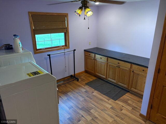 W5168 Lake Rd, Warner Twp, WI 54437 - laundry room featuring washer / clothes dryer, a ceiling fan, and light wood-style flooring