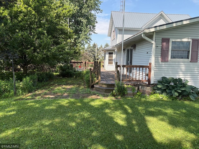 W5168 Lake Rd, Warner Twp, WI 54437 - view of side of property with a lawn and a wooden deck