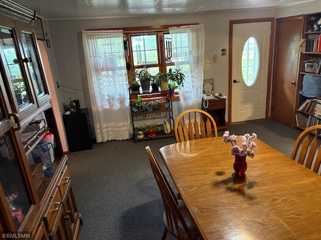 W5168 Lake Rd, Warner Twp, WI 54437 - dining area featuring carpet floors and ornamental molding