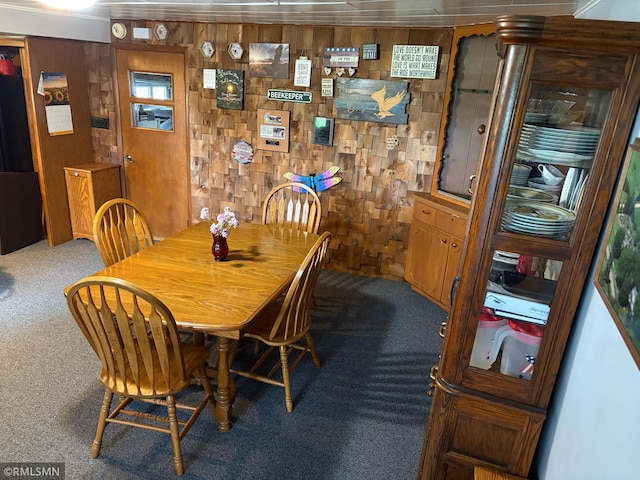 W5168 Lake Rd, Warner Twp, WI 54437 - carpeted dining space featuring wooden walls