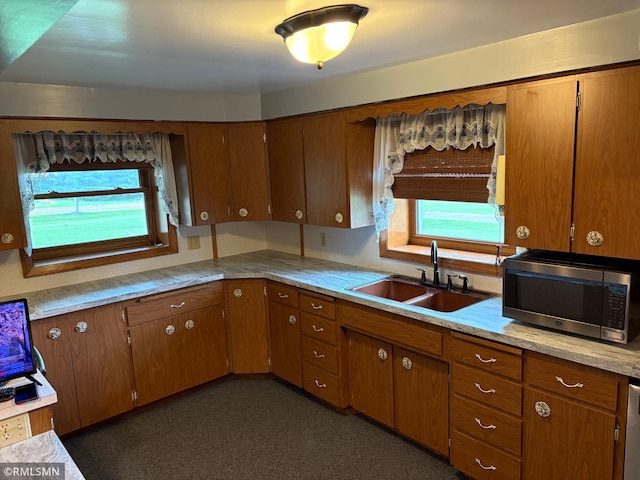 W5168 Lake Rd, Warner Twp, WI 54437 - kitchen featuring appliances with stainless steel finishes, light countertops, and brown cabinets