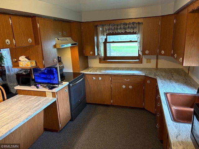 W5168 Lake Rd, Warner Twp, WI 54437 - kitchen with electric range, custom range hood, brown cabinets, and light countertops