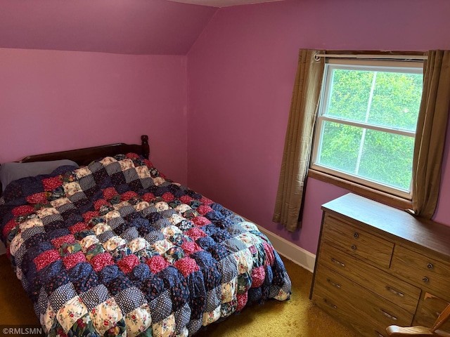 W5168 Lake Rd, Warner Twp, WI 54437 - carpeted bedroom with lofted ceiling and baseboards