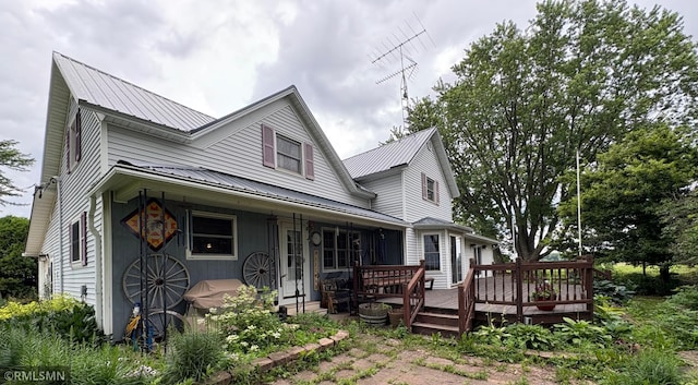 W5168 Lake Rd, Warner Twp, WI 54437 - view of front of home featuring a metal roof and a deck