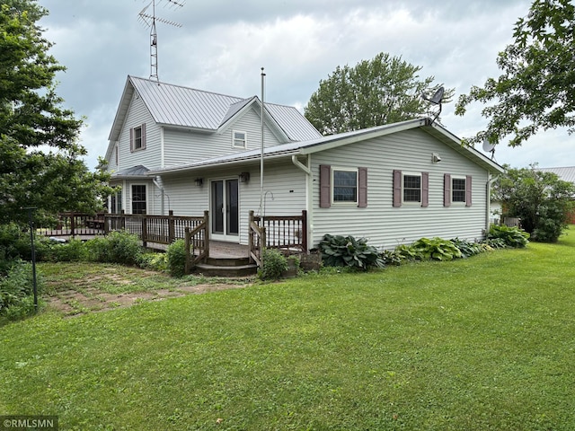 W5168 Lake Rd, Warner Twp, WI 54437 - back of house featuring a deck and a lawn