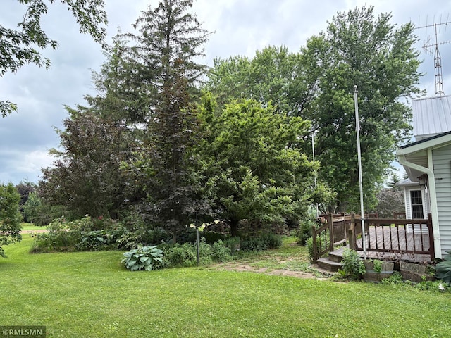 W5168 Lake Rd, Warner Twp, WI 54437 - view of grassy yard featuring a deck