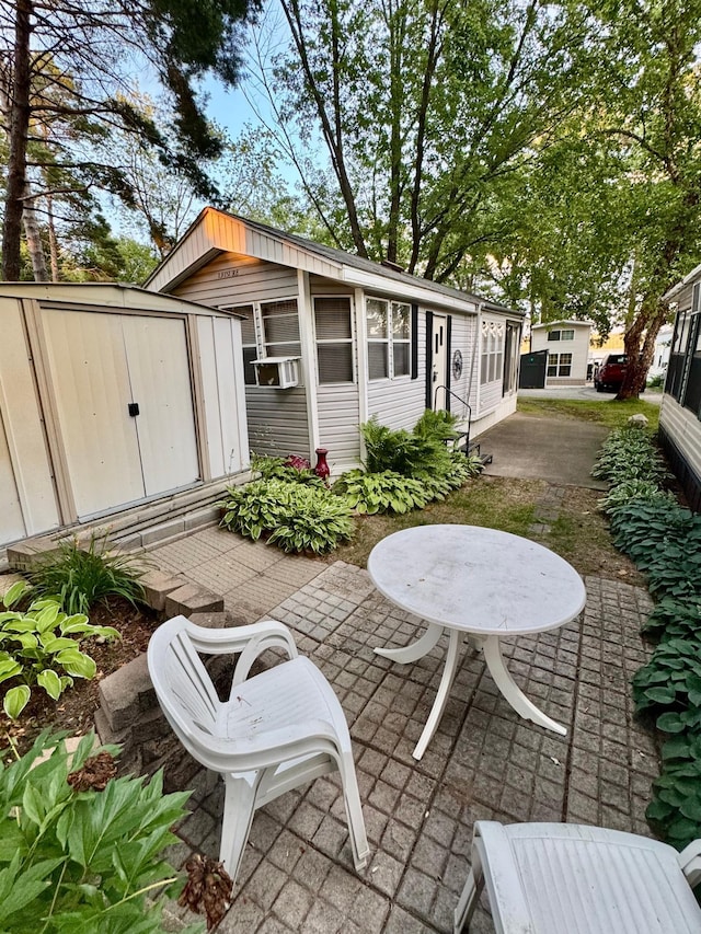 15827 Wilderness Trl Unit 28, Crosslake, MN 56442 - view of patio with a shed