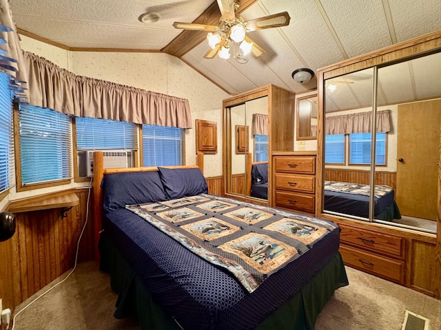15827 Wilderness Trl Unit 28, Crosslake, MN 56442 - carpeted bedroom featuring lofted ceiling, wooden walls, a ceiling fan, cooling unit, and a wainscoted wall
