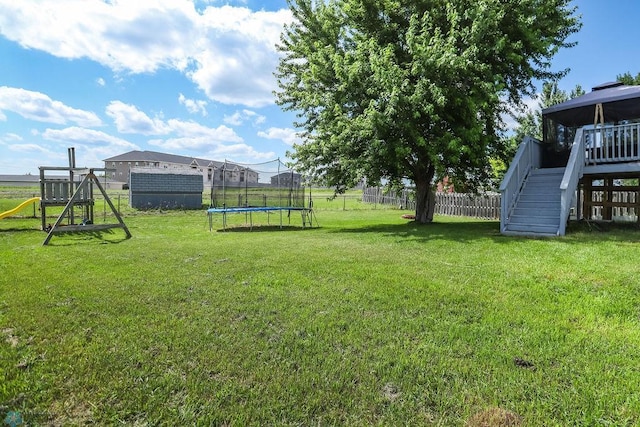 1426 11th St W, West Fargo, ND 58078 - view of yard featuring a trampoline and stairs