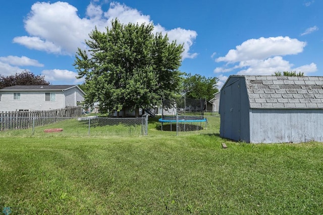 1426 11th St W, West Fargo, ND 58078 - view of yard with a storage shed and a trampoline