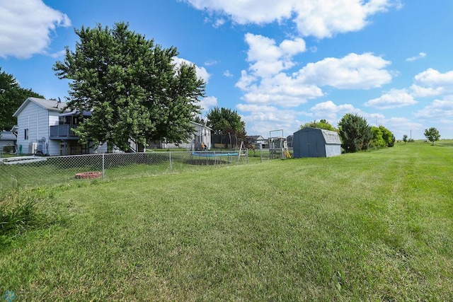 1426 11th St W, West Fargo, ND 58078 - view of yard with a trampoline and a shed