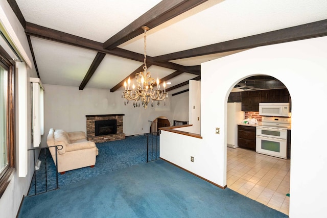 1290 Polk Pl, Columbia Heights, MN 55421 - unfurnished living room with carpet floors, a brick fireplace, a chandelier, arched walkways, and healthy amount of natural light