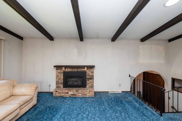 1290 Polk Pl, Columbia Heights, MN 55421 - unfurnished living room with beam ceiling, a brick fireplace, and carpet flooring