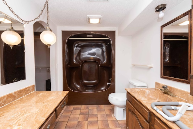 1290 Polk Pl, Columbia Heights, MN 55421 - full bath featuring vanity, a textured ceiling, and stone finish floors