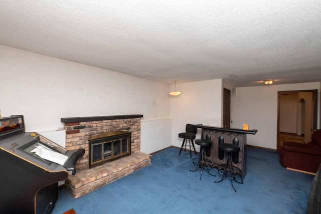 1290 Polk Pl, Columbia Heights, MN 55421 - living room featuring a textured ceiling, carpet, and a fireplace