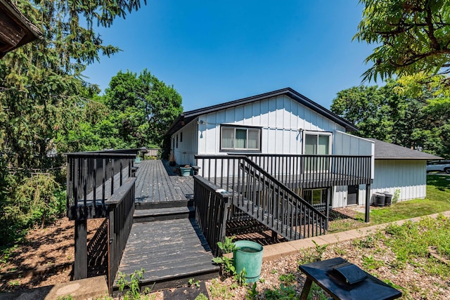 1290 Polk Pl, Columbia Heights, MN 55421 - view of front of house with a deck, stairs, and board and batten siding