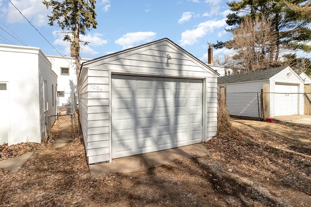 1034 Carroll Ave, Saint Paul, MN 55104 - detached garage featuring a gate