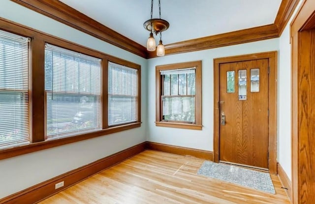4105 Columbus Ave, Minneapolis, MN 55407 - foyer with light wood-style flooring and crown molding