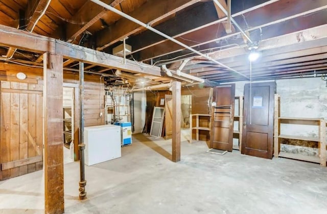 4105 Columbus Ave, Minneapolis, MN 55407 - unfinished basement with fridge