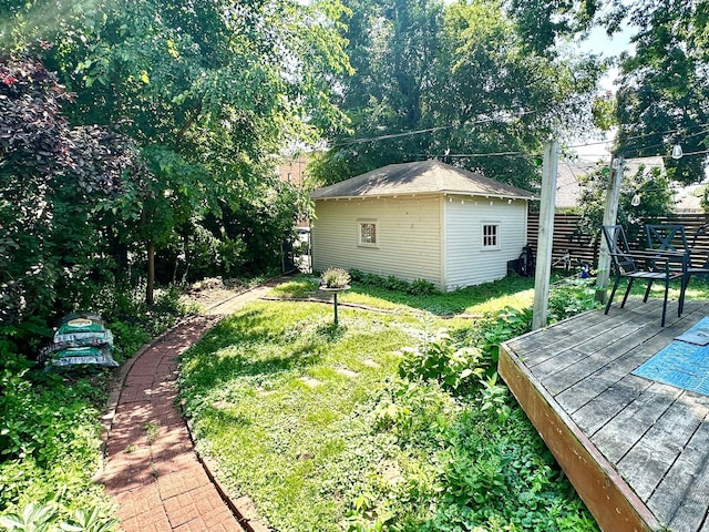 4105 Columbus Ave, Minneapolis, MN 55407 - view of yard featuring a wooden deck and an outbuilding