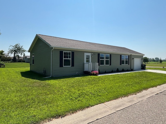 675 Brooks St S, Eden Valley, MN 55329 - ranch-style house featuring driveway, a front lawn, and an attached garage